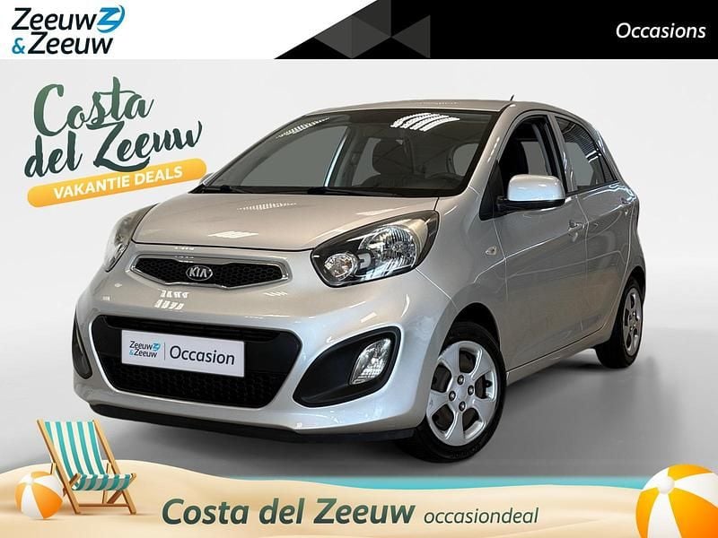 Silver metallic (3d) Gebruikt 2012 Kia Picanto Comfort Hatchback | € 6.750 (Eerlijke prijs) - Afbeelding 1/4