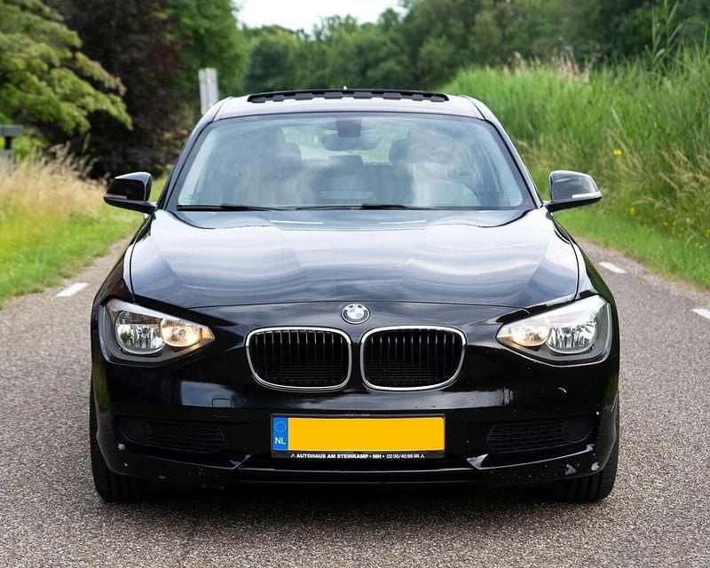 Zwart Gebruikt 2012 BMW 116 Hatchback | € 7.499 (Goede deal) - Afbeelding 1/4