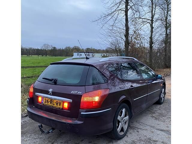 Paars (metallic) Gebruikt 2005 Peugeot 407 Stationwagen | € 1.450 (Iets duurder) - Afbeelding 1/4