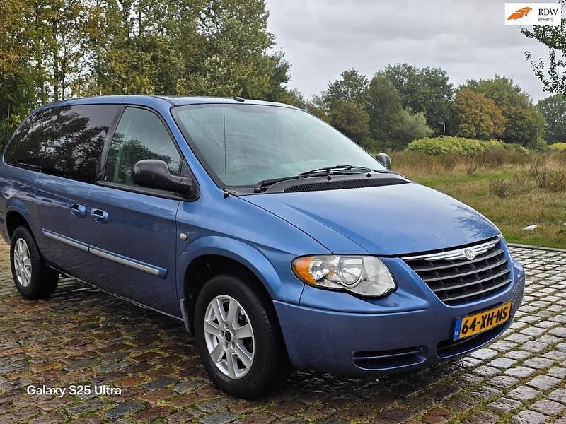 Blauw (metallic) Gebruikt 2007 Chrysler Voyager MPV | € 3.999 - Afbeelding 1/4