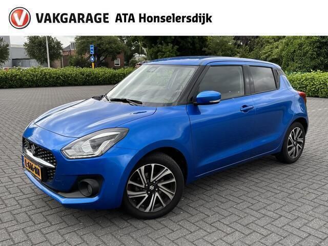 Blauw, metallic lak Gebruikt 2021 Suzuki Swift Style Hatchback | € 18.250 (Eerlijke prijs) - Afbeelding 1/4