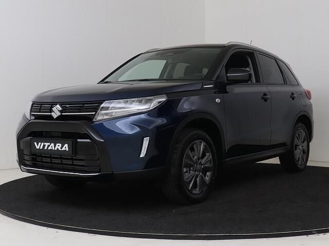Blauw, metallic lak Nieuw 2025 Suzuki Vitara SUV | € 31.348 (Eerlijke prijs) - Afbeelding 1/4