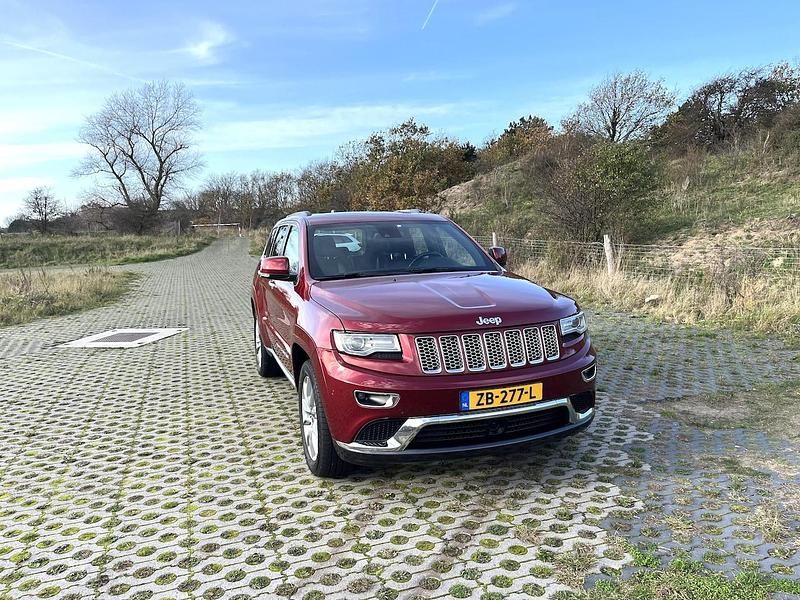 Rood (metallic) Gebruikt 2016 Jeep Grand Cherokee Overland SUV | € 29.500 - Afbeelding 1/4