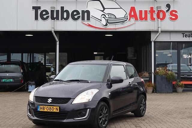 Grijs Gebruikt 2015 Suzuki Swift Comfort Hatchback | € 4.985 (Goede deal) - Afbeelding 1/4