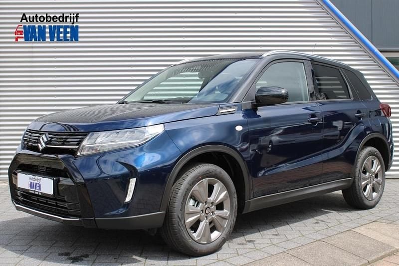 Blauw Nieuw 2025 Suzuki Vitara SUV | € 32.690 (Eerlijke prijs) - Afbeelding 1/4