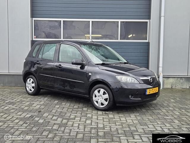 Zwart Occasion 2006 Mazda 2 Touring MPV | € 2.099 (Eerlijke prijs) - Afbeelding 1/4