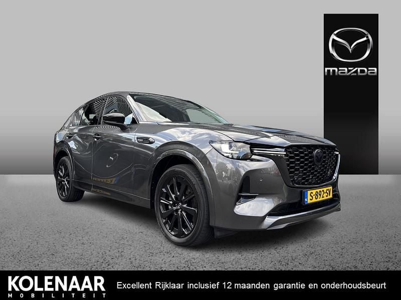 Machine gray Gebruikt 2023 Mazda CX-60 Homura-Line SUV | € 39.895 (Eerlijke prijs) - Afbeelding 1/4