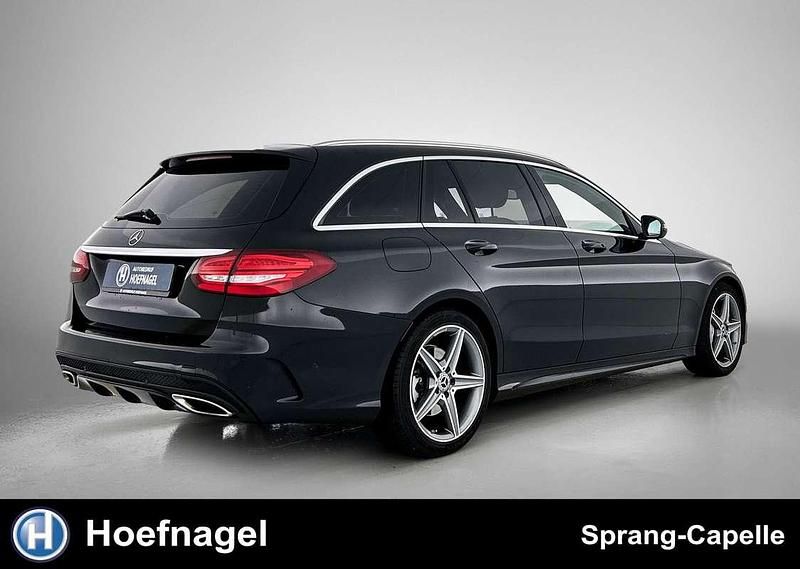 Occasion Mercedes C180 AMG line 157 PK (115 kW) 2018 Zwart Stationwagen