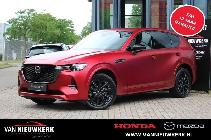 Soul red chrysthal (rood metallic) Gebruikt 2024 Mazda CX-60 Homura-Line SUV | € 49.900 (Eerlijke prijs) - Afbeelding 1/4