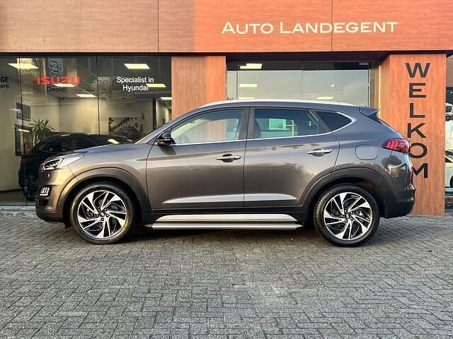 Bruin (metallic) Gebruikt 2019 Hyundai Tucson Premium SUV | € 24.950 (Eerlijke prijs) - Afbeelding 1/4