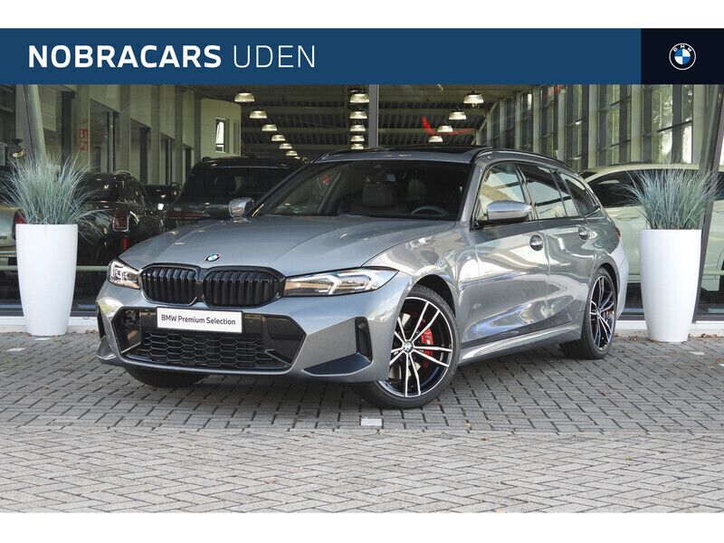 Skyscraper grey Gebruikt 2024 BMW 318 M Sport Stationwagen | € 46.950 - Afbeelding 1/4