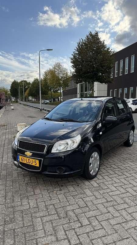Zwart Gebruikt 2010 Chevrolet Aveo LS Hatchback | € 1.500 - Afbeelding 1/4