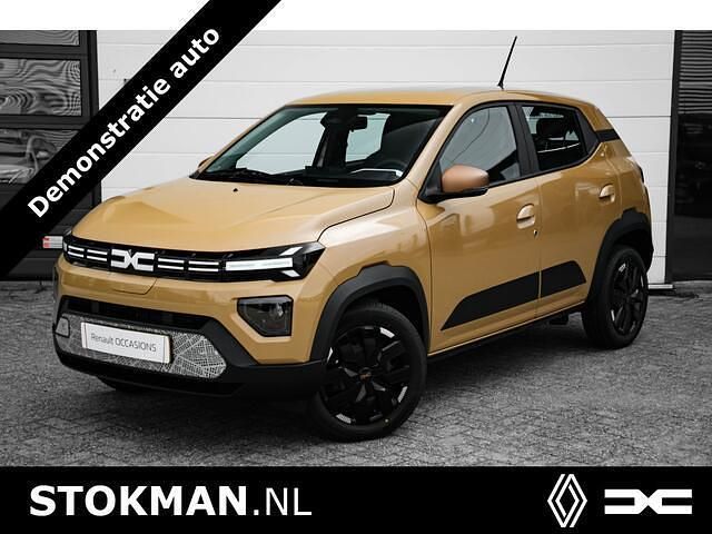 Bruin Nieuw 2024 Dacia Spring Extreme Hatchback | € 22.700 - Afbeelding 1/4