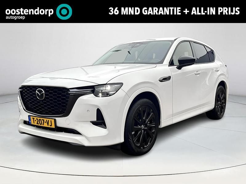 Rhodium white metallic (51k) Gebruikt 2023 Mazda CX-60 Homura-Line SUV | € 42.740 (Eerlijke prijs) - Afbeelding 1/4