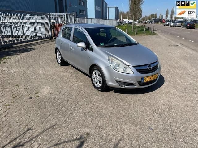 Grijs Gebruikt 2009 Opel Corsa Enjoy Hatchback | € 2.599 (Goede deal) - Afbeelding 1/4