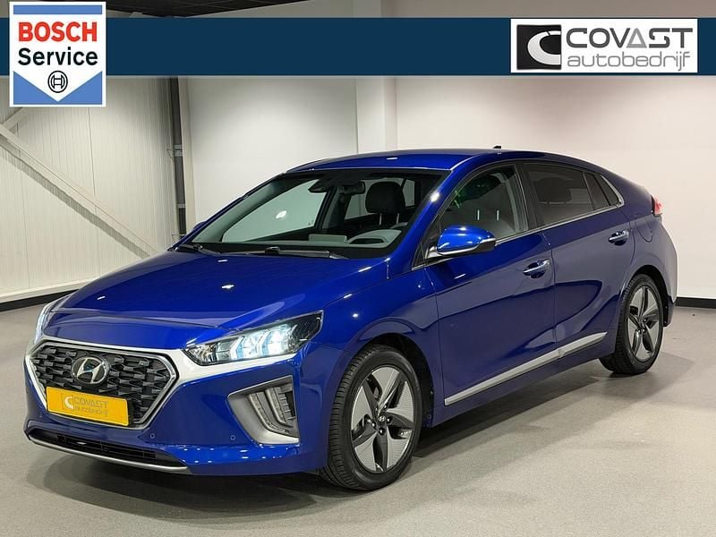 Blauw (metallic) Gebruikt 2021 Hyundai Ioniq Premium Hatchback | € 18.950 (Eerlijke prijs) - Afbeelding 1/4