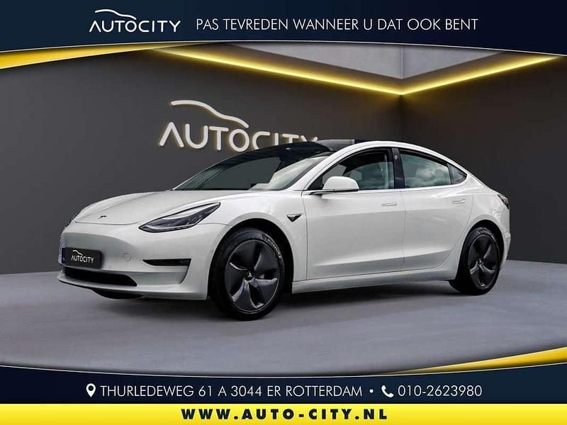 Wit, metallic lak Gebruikt 2020 Tesla Model 3 Long Range Sedan | € 19.950 (Goede deal) - Afbeelding 1/4