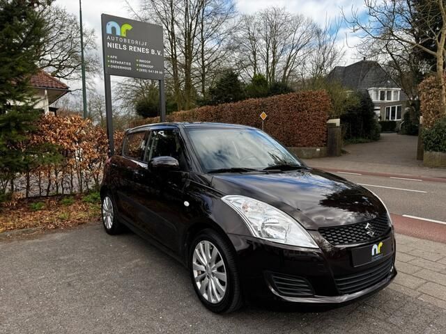Bruin, andere lak Gebruikt 2012 Suzuki Swift Hatchback | € 7.950 (Iets duurder) - Afbeelding 1/4