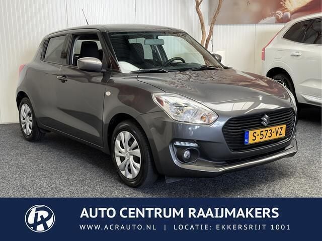 Grijs, metallic lak Gebruikt 2019 Suzuki Swift Hatchback | € 13.740 (Eerlijke prijs) - Afbeelding 1/4