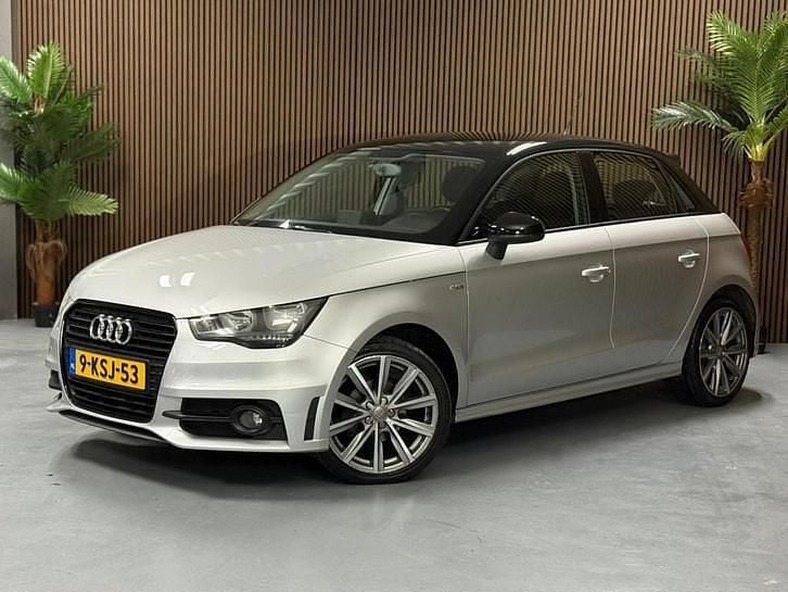 Grijs (metallic) Gebruikt 2013 Audi A1 Sportback Admired Hatchback | € 6.995 (Eerlijke prijs) - Afbeelding 1/4