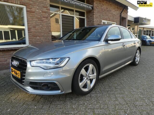 Grijs, metallic lak Gebruikt 2012 Audi A6 Comfort Sedan | € 14.950 (Iets duurder) - Afbeelding 1/4