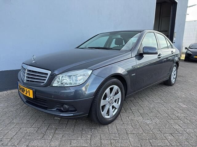 Grijs Gebruikt 2010 Mercedes C180 Business Sedan | € 9.450 (Eerlijke prijs) - Afbeelding 1/4