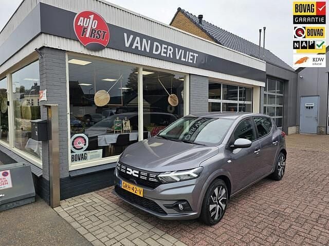 Grijs Gebruikt 2024 Dacia Sandero Expression Hatchback | € 17.450 (Eerlijke prijs) - Afbeelding 1/4
