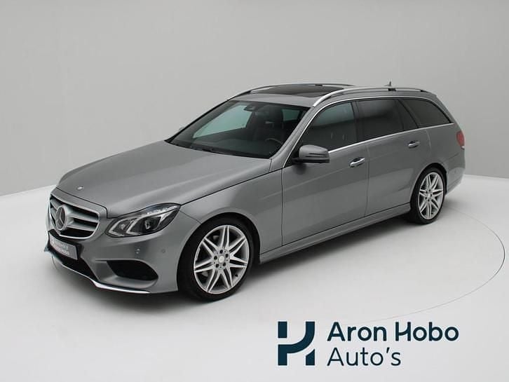 Grijs, metallic lak Gebruikt 2013 Mercedes E350 AMG Stationwagen | € 19.950 (Duur) - Afbeelding 1/4