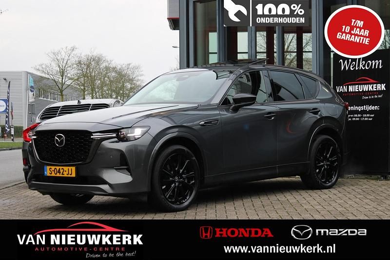 Machine grey (grijs metallic) Gebruikt 2023 Mazda CX-60 Homura-Line SUV | € 40.740 (Eerlijke prijs) - Afbeelding 1/4