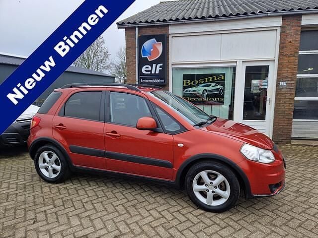 Oranje (metallic) Occasion 2009 Suzuki SX4 MPV | € 3.844 (Eerlijke prijs) - Afbeelding 1/4