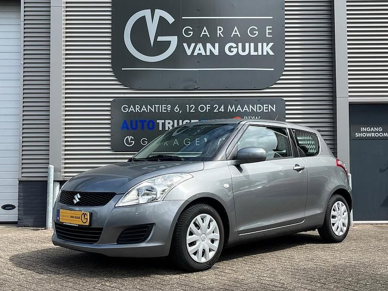 Grijs, metallic lak Occasion 2012 Suzuki Swift Comfort Hatchback | € 4.495 (Eerlijke prijs) - Afbeelding 1/3