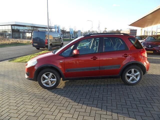 Oranje Gebruikt 2007 Suzuki SX4 Exclusive MPV | € 4.450 (Eerlijke prijs) - Afbeelding 1/4