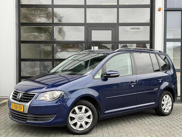 Blauw Gebruikt 2010 VW Touran Freestyle MPV | € 3.995 - Afbeelding 1/4