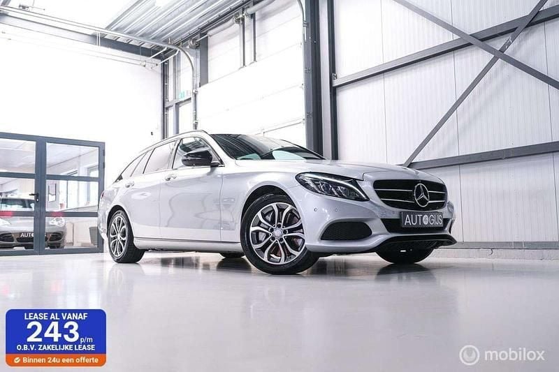 Grijs, metallic lak Gebruikt 2015 Mercedes C350e Edition Stationwagen | € 14.990 (Eerlijke prijs) - Afbeelding 1/4