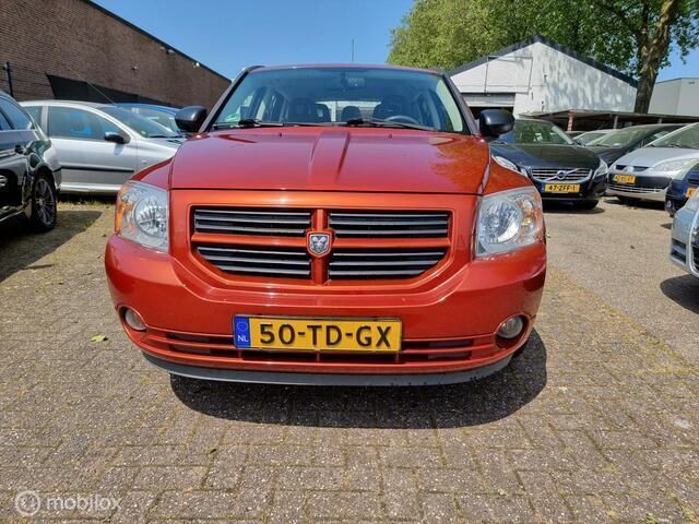Oranje Gebruikt 2006 Dodge Caliber SXT Hatchback | € 3.495 (Duur) - Afbeelding 1/4
