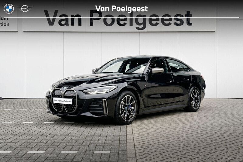 Black sapphire metallic (zwart metallic) Gebruikt 2023 BMW i4 Basis Sedan | € 58.900 (Eerlijke prijs) - Afbeelding 1/4