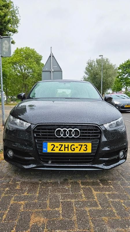 Zwart (metallic) Gebruikt 2015 Audi A1 Admired Hatchback | € 8.350 (Eerlijke prijs) - Afbeelding 1/4