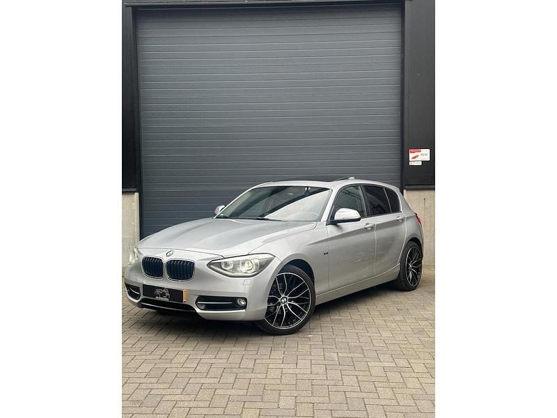 Grijs Gebruikt 2012 BMW 116 Sport Line Hatchback | € 7.999 (Goede deal) - Afbeelding 1/4