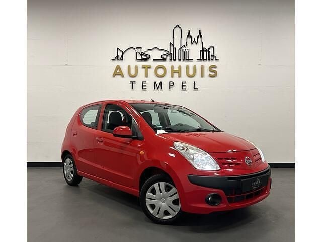 Rood Gebruikt 2009 Nissan Pixo Acenta Hatchback | € 3.690 (Eerlijke prijs) - Afbeelding 1/4