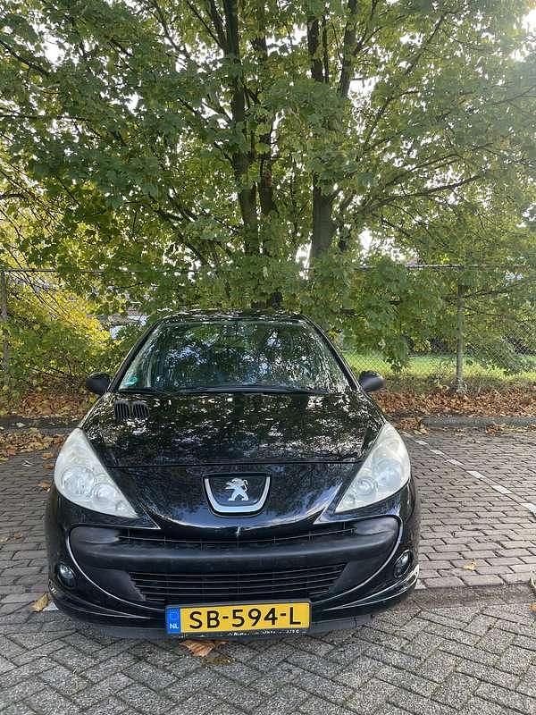 Zwart Gebruikt 2011 Peugeot 206 Sportium Hatchback | € 1.799 (Goede deal) - Afbeelding 1/4