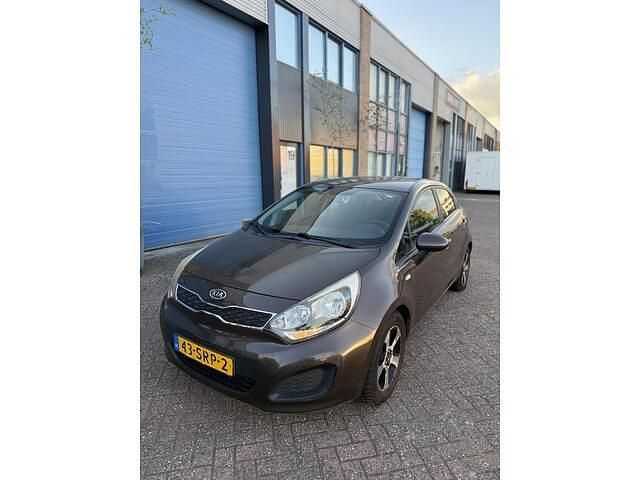 Bruin Gebruikt 2011 Kia Rio Comfort Hatchback | € 4.399 (Eerlijke prijs) - Afbeelding 1/4