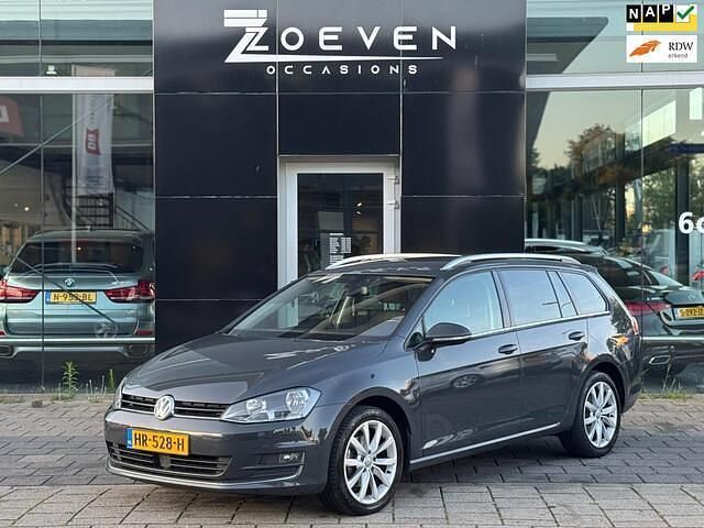 Grijs, metallic lak Gebruikt 2016 VW Golf VII Highline Stationwagen | € 8.995 (Eerlijke prijs) - Afbeelding 1/4