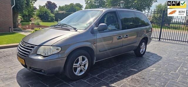 Grijs Gebruikt 2006 Chrysler Grand Voyager MPV | € 3.950 (Eerlijke prijs) - Afbeelding 1/4