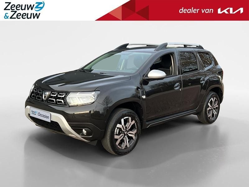 Parelzwart 676 Gebruikt 2022 Dacia Duster Prestige SUV | € 17.245 (Goede deal) - Afbeelding 1/4