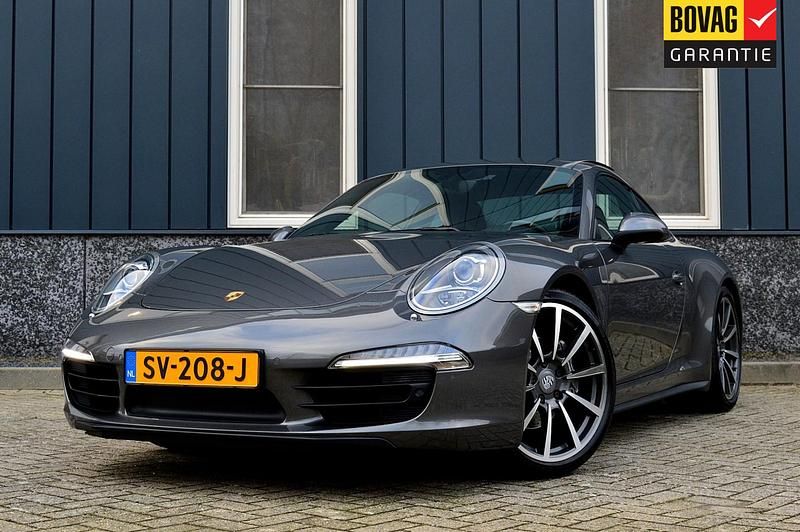 Grijs, metallic lak Gebruikt 2014 Porsche 911 Carrera 4 Coupé | € 77.950 - Afbeelding 1/4