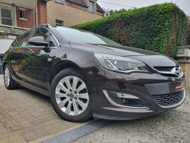 Bruin Gebruikt 2015 Opel Astra Enjoy Stationwagen | € 5.490 (Eerlijke prijs) - Afbeelding 1/4