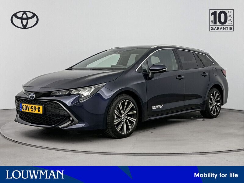 Blauw Gebruikt 2024 Toyota Corolla Hybrid Stationwagen | € 32.990 - Afbeelding 1/3