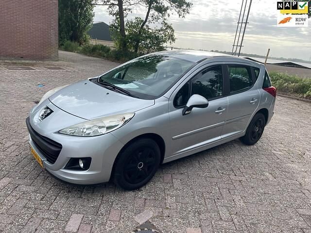 Grijs Gebruikt 2011 Peugeot 207 Stationwagen | € 2.399 (Eerlijke prijs) - Afbeelding 1/4