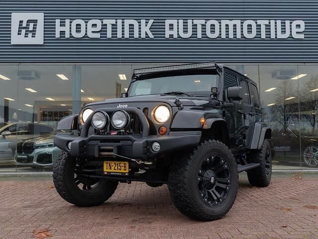 Zwart Gebruikt 2012 Jeep Wrangler Unlimited Sahara SUV | € 37.940 - Afbeelding 1/4