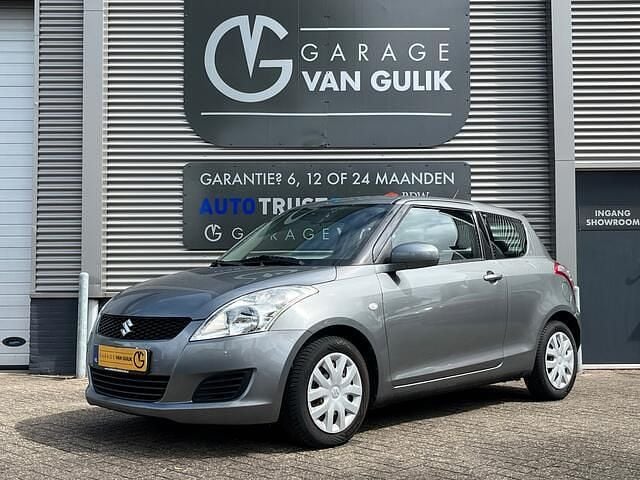 Grijs, metallic lak Gebruikt 2012 Suzuki Swift Comfort Hatchback | € 4.995 (Eerlijke prijs) - Afbeelding 1/2